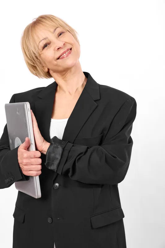 Businesswoman, smartphone, tablet, confident portrait, mature woman smiling, professional blazer, looking aside, white background studio, communication and technology concept, soft light, clean