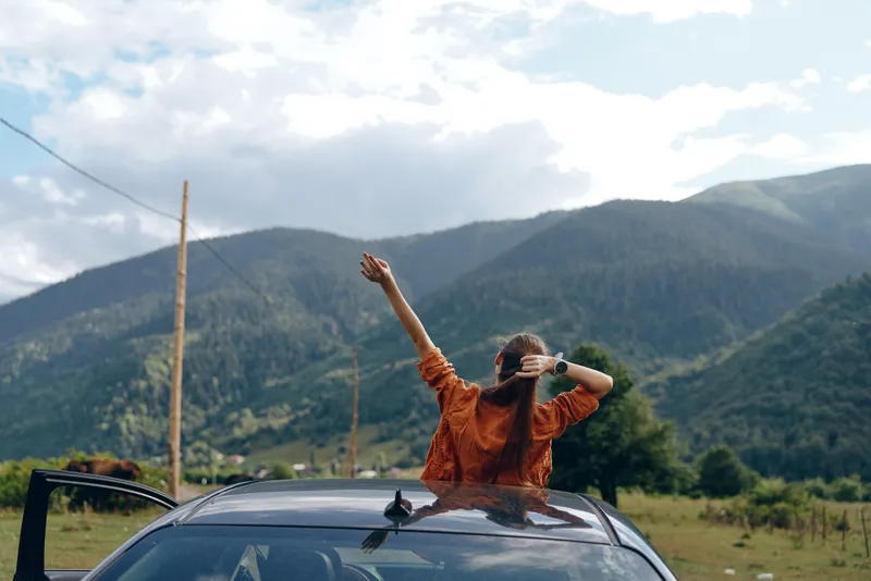 woman car mountains freedom authenticity inclusivity travel