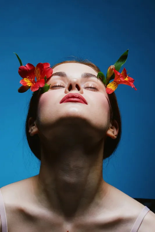 A serene model with floral accents, showcasing natural beauty and tranquility, perfect for concepts like wellness and self care in vibrant colors