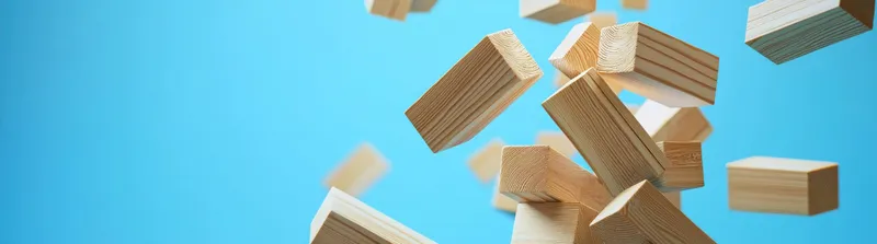Динамичная композиция из падающих деревянных блоков на ярком синем фоне, идеально подходящая для тем творчества, игривости и детства, вдохновляющая на воображение и исследования