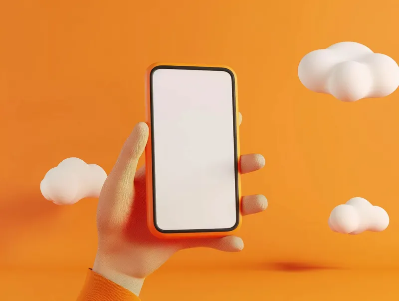 Рука, держащая iPhone с пустым экраном на оранжевом фоне для концепций путешествий, бизнеса и моды