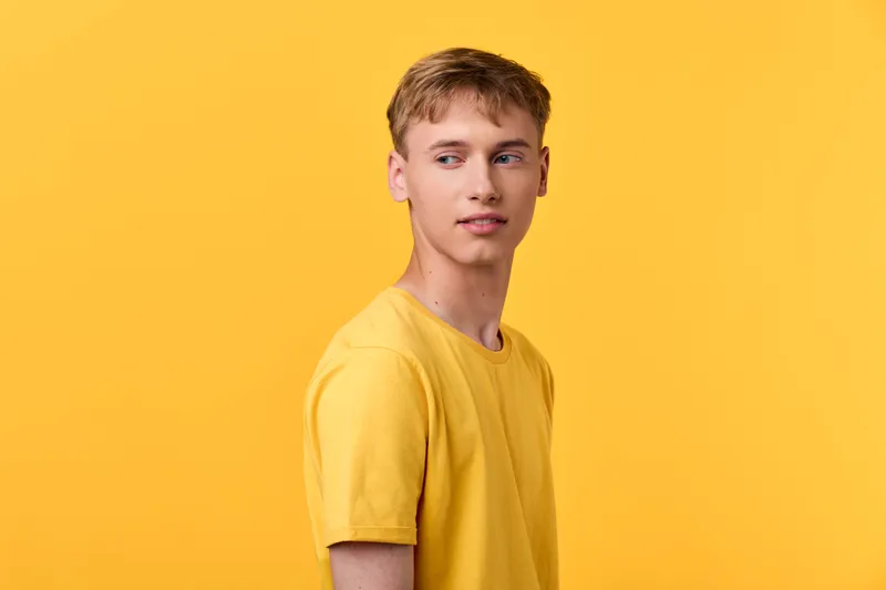 yellow shirt, male, young man, yellow background, fashion, casual, studio, model, pose, bright, color, lifestyle, lighting, clean, minimal, modern, contemporary, expression, youth, confidence,