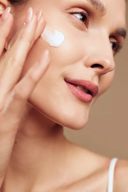 Woman skincare beauty face eye cream moisturizer treatment spa wellness concept, close up portrait, applying white gel under eye for hydration antiaging, smooth fresh skin