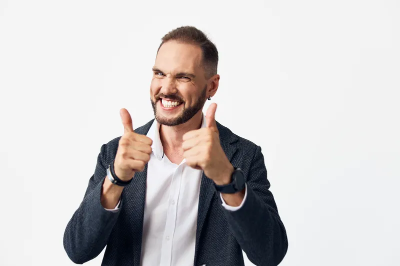 A professional businessman exudes confidence against a bright, isolated color background, capturing a moment of clear emotion, focus, and dynamic energy. This scene emphasizes corporate poise and