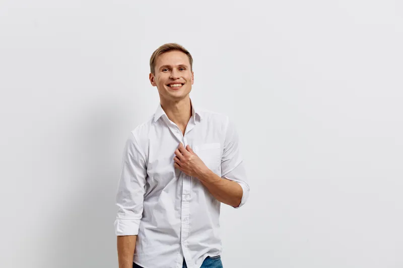smiling young man white shirt casual look isolated on white background digital nomad technology concept remote work lifestyle modern life