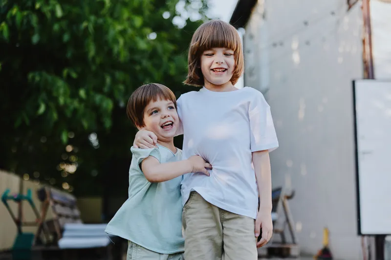 Happy children playing outdoors together, enjoying their time in the sun with smiles and laughter, creating lasting memories in a vibrant environment.