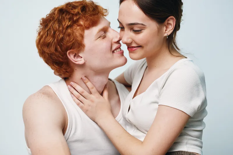 Couple, love, affection, smile, intimacy, young, woman, man, relationship, redhead, white background, casual clothes, happiness, closeup, romantic moment