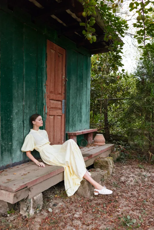 Woman porch cottage vintage dress authenticity inclusivity rest