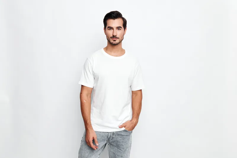 Full body handsome young man wear casual white t-shirt stand confidently against plain solid white background. Lifestyle concept, modern fashion style.