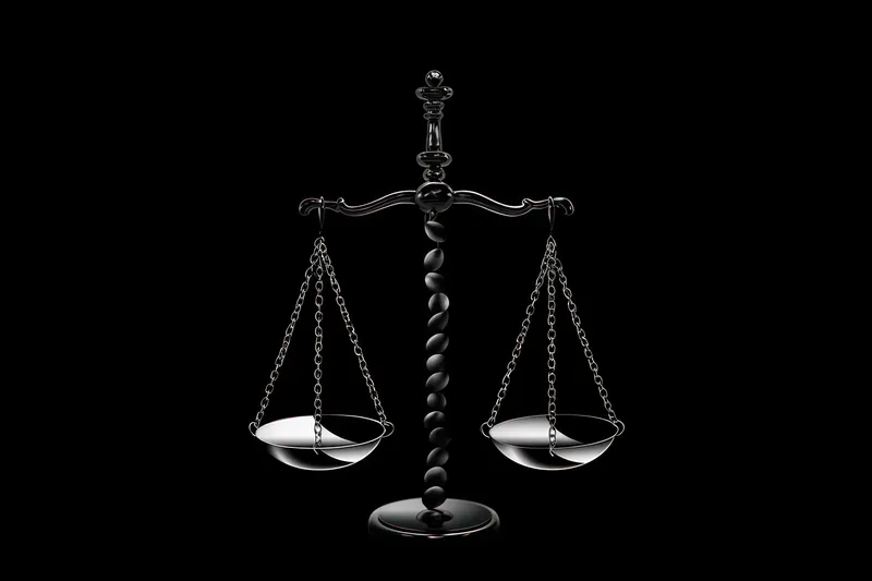 Изображение весов правосудия, символизирующих закон и равенство