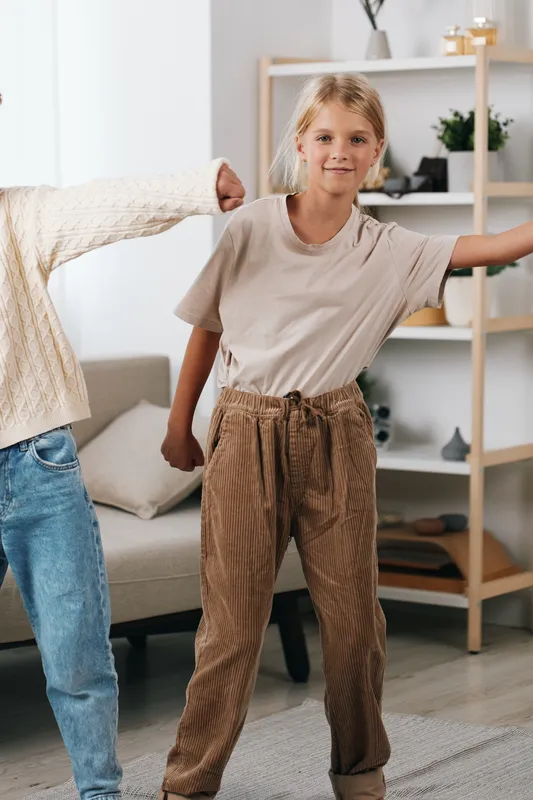 Authentic scene of a child in a cozy home, engaged in playful activity that hints at school readiness, curiosity, and everyday lifestyle in a bright setting.
