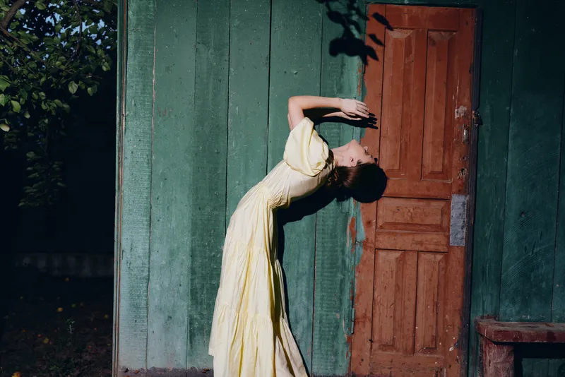 woman dress vintage doorway pose fashion portrait evening authenticity inclusivity
