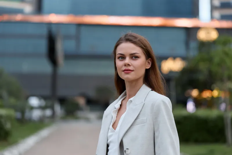 confident woman in white blazer portrait city background business style outdoor season spring summer confident woman professional