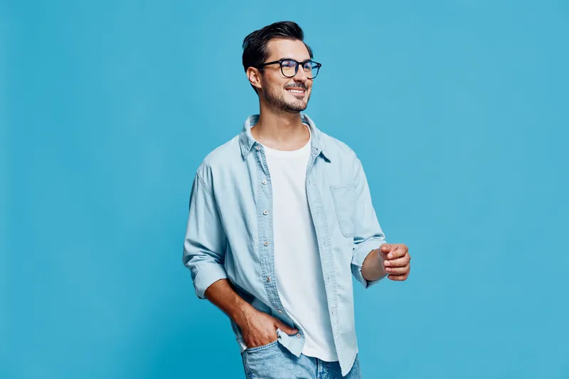 Full body smiling cheerful young man wear casual outfit look camera isolated on bright solid blue background studio portrait. People lifestyle concept.