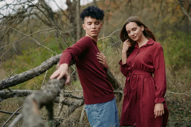 Candid portrait of two young adults outdoors, capturing authenticity and trustworthiness in soft natural light, subtle poses and relaxed styling to convey a genuine lifestyle moment.
