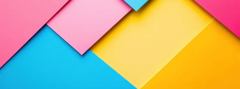 Яркая и жизнерадостная композиция из сложенных слоями листов розовой, синей и желтой бумаги, идеально подходящая для креативных дизайн-проектов с веселой и красочной тематикой