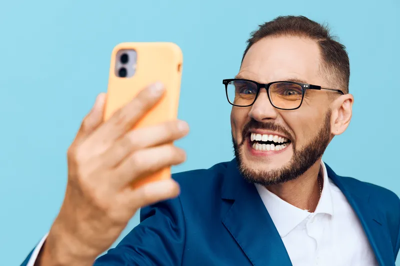Business professional man on a colored isolated background, showing confident energy, positive smile, and poised posture, ready to engage ideas, deliver value, and lead with clarity.