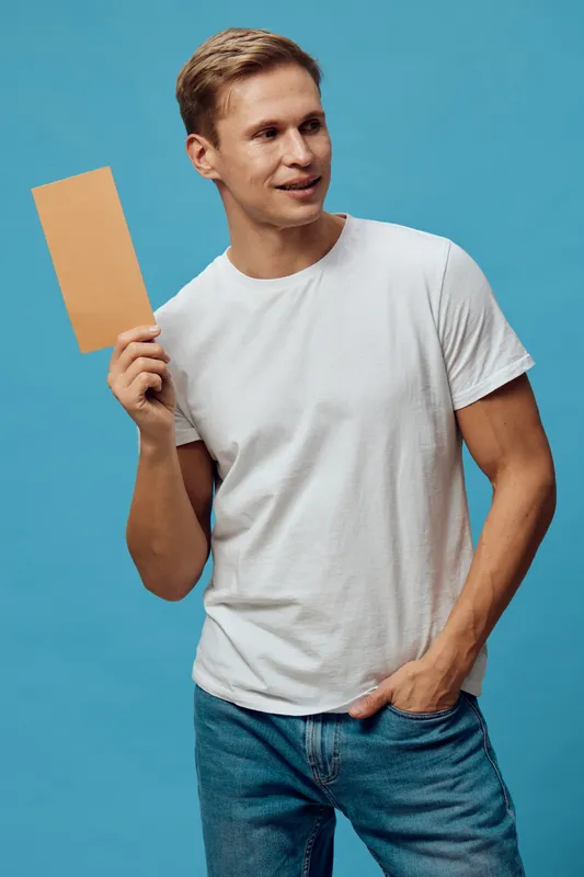 smiling man holding cardboard communication digital nomad casual clothes blue background cheerful lifestyle concept