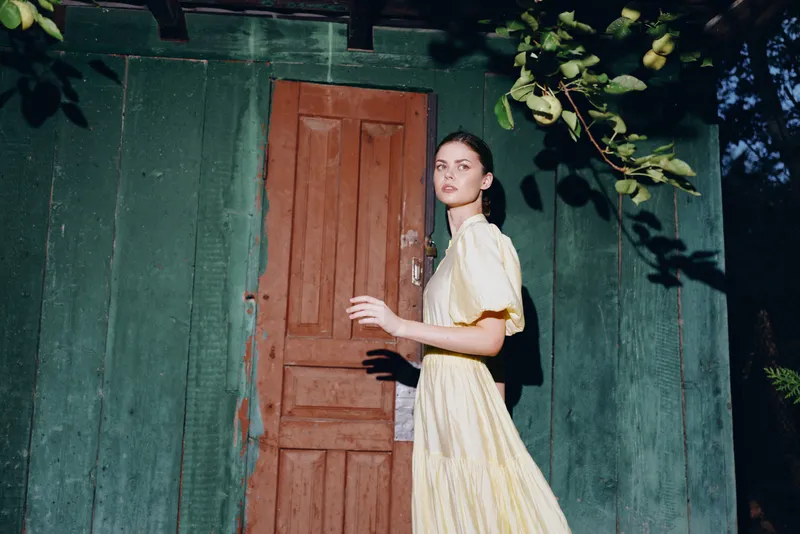 woman portrait wooden door vintage outdoor authenticity inclusivity