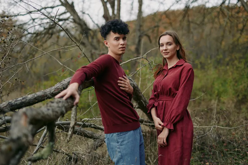 Authentic scene featuring two individuals in a natural setting, casual attire, candid pose, genuine emotion, and a subtle connection that conveys realism and trust.