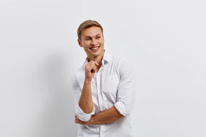 Smiling man working digital nomad white shirt casual look isolated plain background technology remote freelancer concept