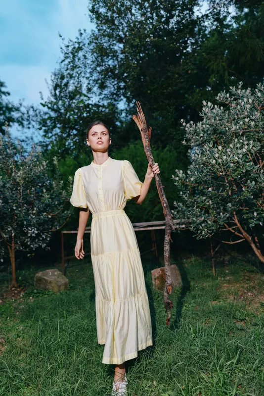Woman authenticity inclusivity dress outdoors with stick