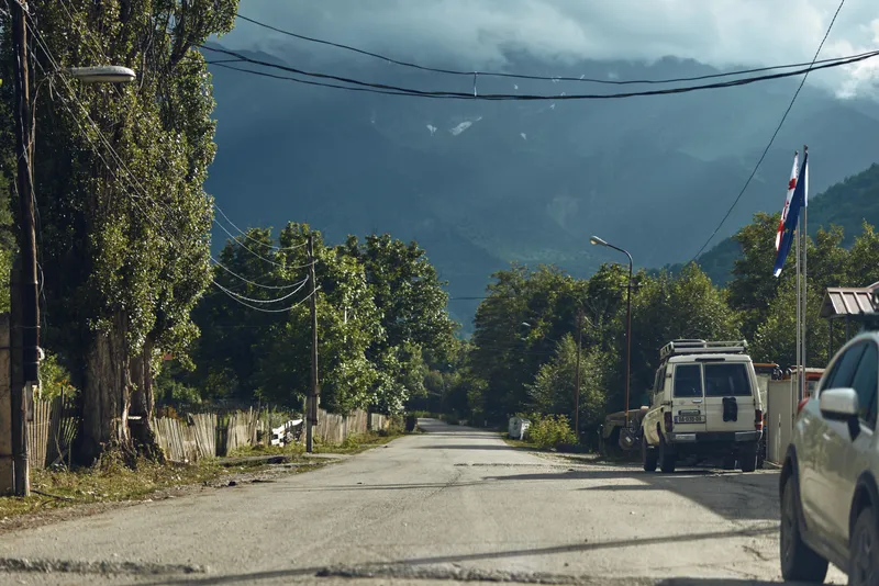 street mountain cloudy car rural authenticity inclusivity