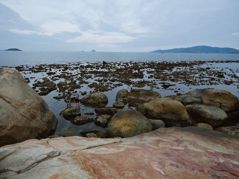 Serenity at Low Tide A tranquil coastal scene featuring rocks and water, perfect for relaxation and nature themed projects