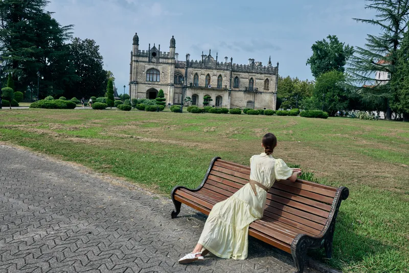woman bench mansion park authentic inclusive