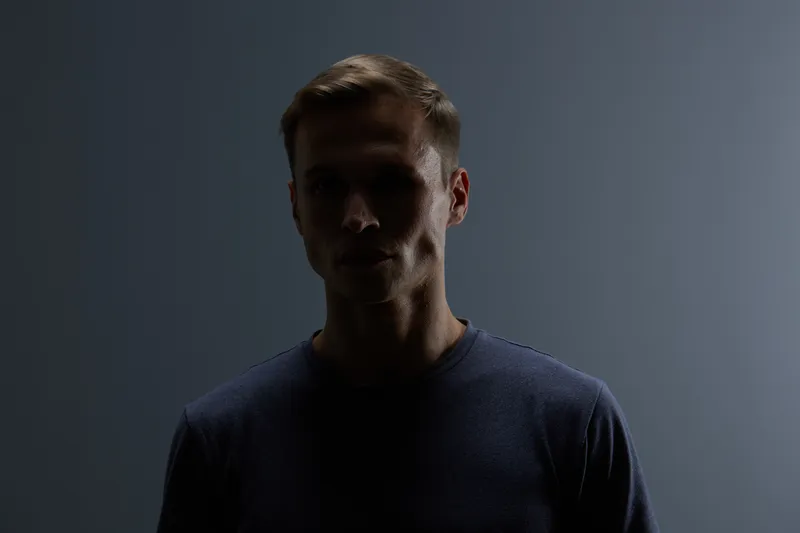 silhouette man dark moody low key portrait studio concept artificial intelligence digital transformation shadows