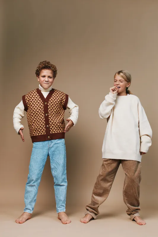 Authentic scene featuring children in playful outfits, highlighting school themed fashion and a casual lifestyle moment for everyday life.