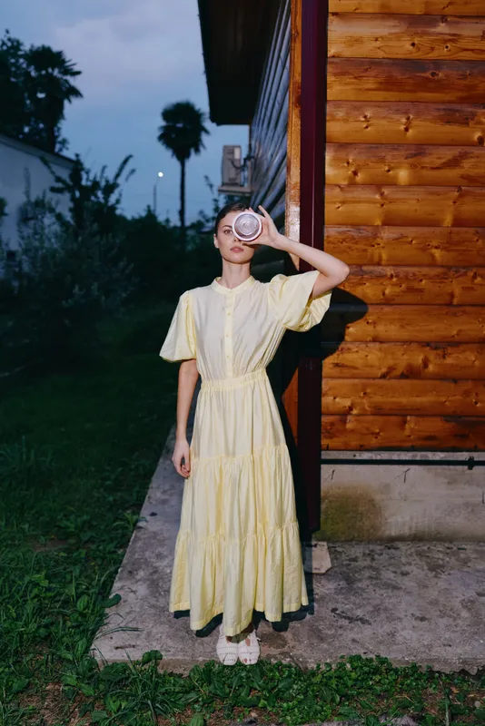Woman vintage dress portrait evening wooden wall authenticity inclusivity