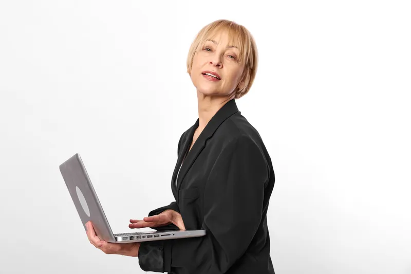 Woman business consulting presentation clipboard tablet corporate professional in black blazer holding tablet and clipboard, standing against white background, suggesting calm office support and