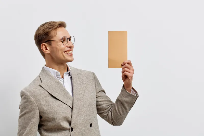 Smiling man in checkered blazer hold paper tablet look side portrait white background digital nomad remote work concept