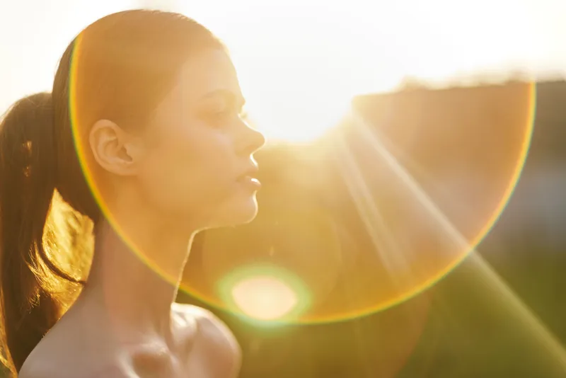 Profile of a young model against a sunset background, showcasing natural beauty, serenity, and warm colors This image embodies healthy living and self reflection
