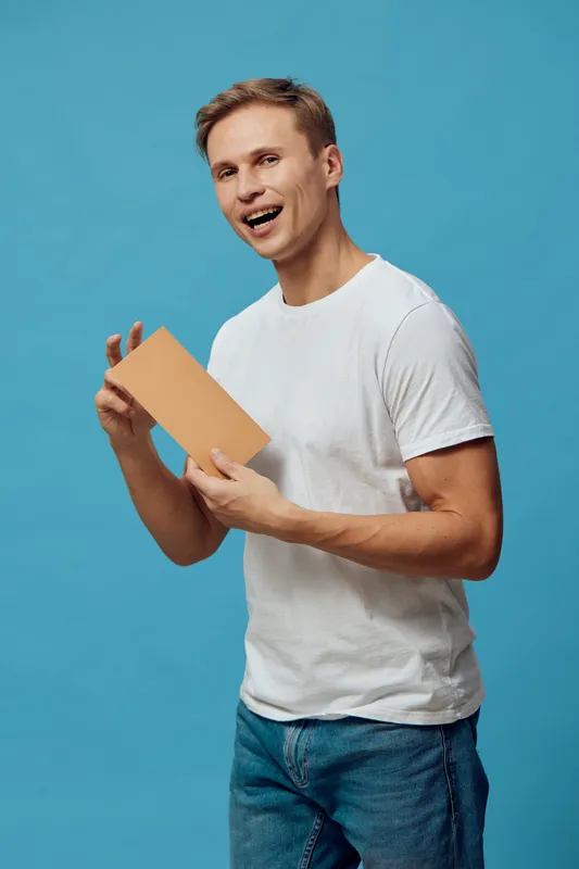 smiling man holding tablet digital nomad casual wear standing blue background freelance remote work concept