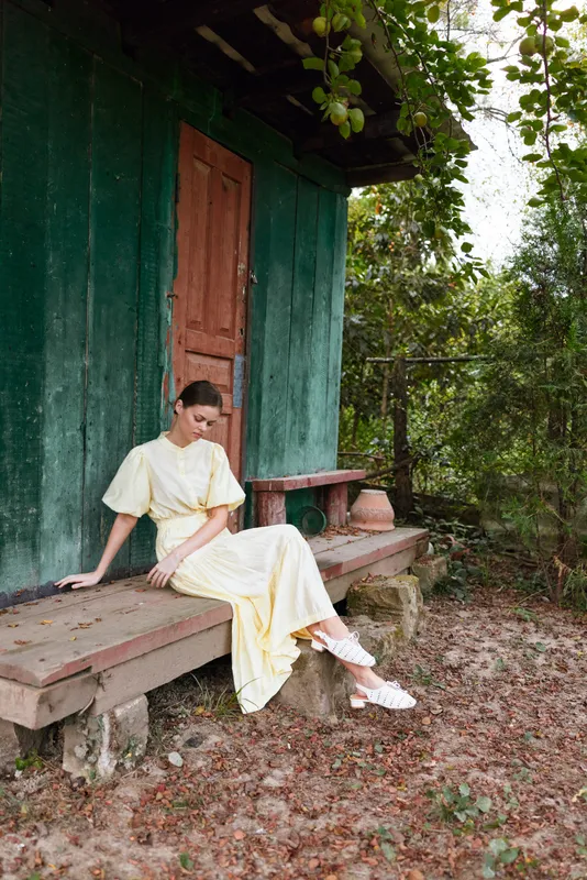 Woman dress rustic porch bench nature authenticity inclusive