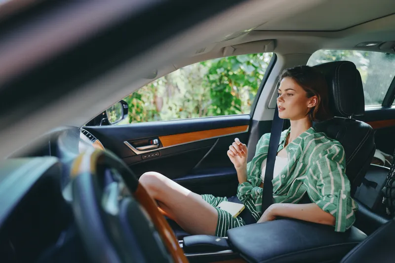 Car, woman, smile a calm woman sits in the passenger seat with relaxed posture and a composed expression, enjoying a peaceful moment inside the car, ready for a journey