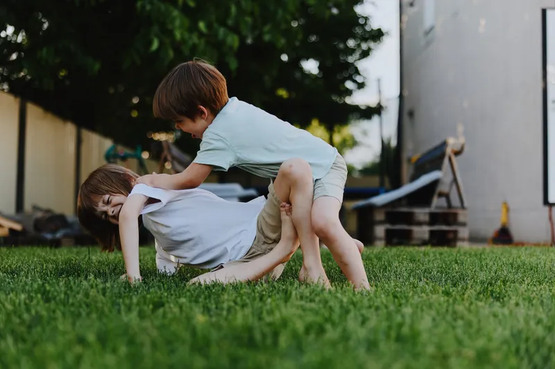 Playful children enjoying a sunny day, engaging in fun outdoor activities, capturing the essence of childhood joy and friendship.