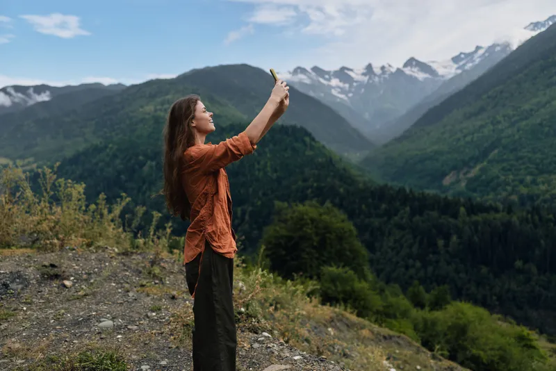 woman mountains landscape smartphone outdoor hiking nature selfie authenticity inclusivity scenic travel