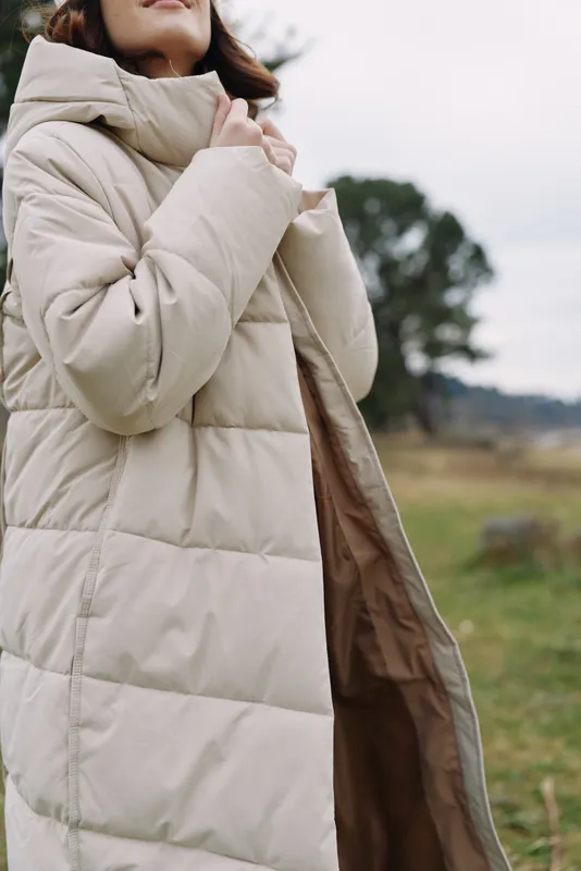 Coat, outdoor scene with a person wearing a warm puffer jacket in a chilly countryside, showcasing fashion, comfort and practical outerwear.