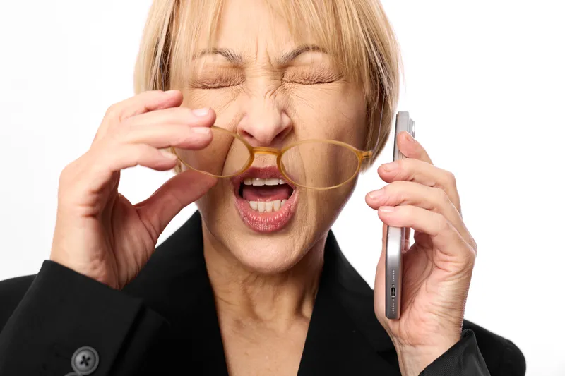 Woman businesswoman stress burnout phone eyeglasses overwhelmed fatigue frustration crisis, tears, eyes closed, holding phone receiver, workplace distress anxiety, overwork
