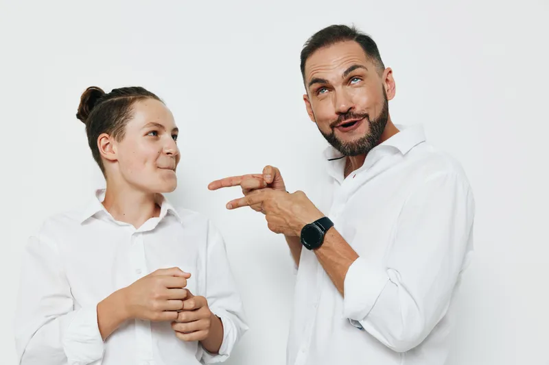 Professional man in a white shirt on a colored isolated background, expressing confidence and approachable emotion suitable for business, leadership, and teamwork scenarios.