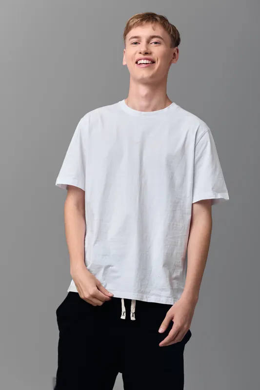 t shirt casual wear smiling man youth fashion everyday outfit and comfortable clothing for relaxed street style and casual lifestyle, studio shoot with a bright friendly vibe