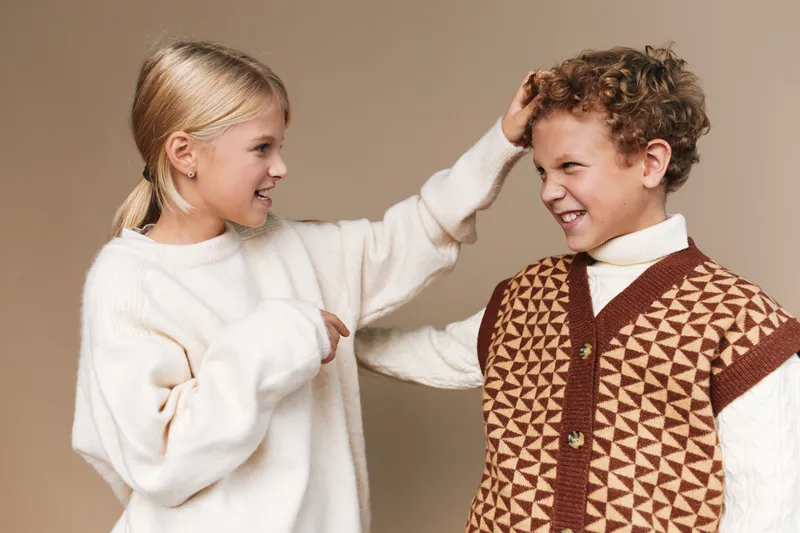 Authentic scene of children at play, a school lifestyle moment captured with warmth and candor, featuring casual outfits and a cheerful, spontaneous expression.