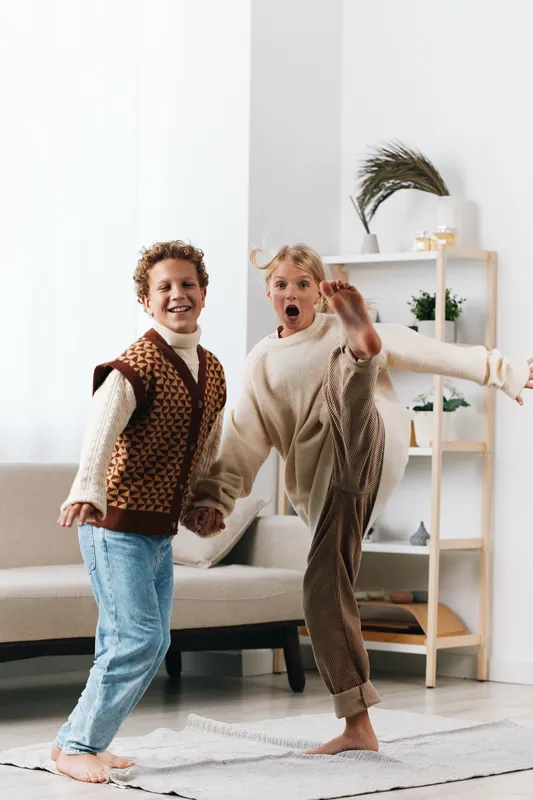 Authenticity shines as children explore play in a cozy home, a lively moment reflecting school age energy and a warm lifestyle that invites imagination and everyday joy.