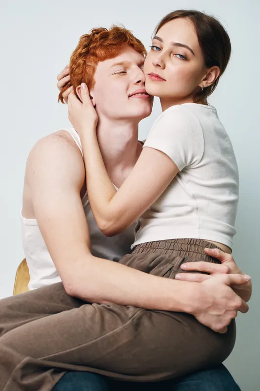 Couple, love, and intimacy with young man and woman hugging closely. Emotional connection in casual clothes with affection and tenderness for relationship and romance together.