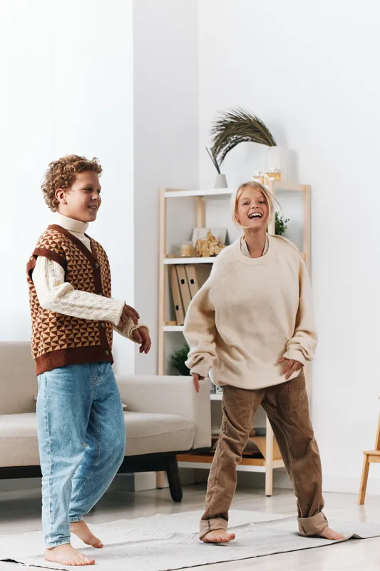 Authentic moment of children at home during playful activity, highlighting school inspired curiosity and everyday lifestyle in a candid, joyful, sunlit scene.
