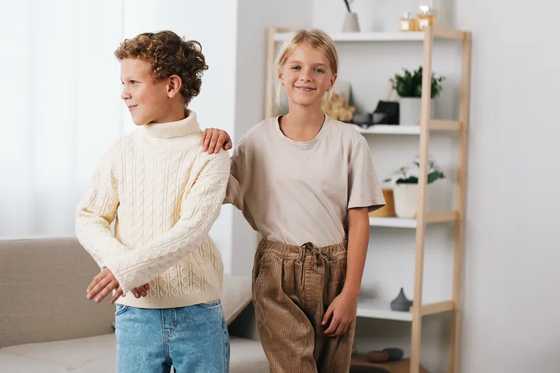 An authentic candid scene featuring children in a playful school lifestyle moment, highlighting imagination, teamwork, and daily learning at home with joy.