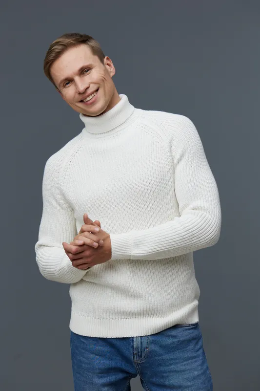 smiling young caucasian man wear white knitted turtleneck sweater blue jeans posing isolated on gray studio background cyber security concept
